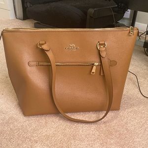 Brown coach bag with gold detail